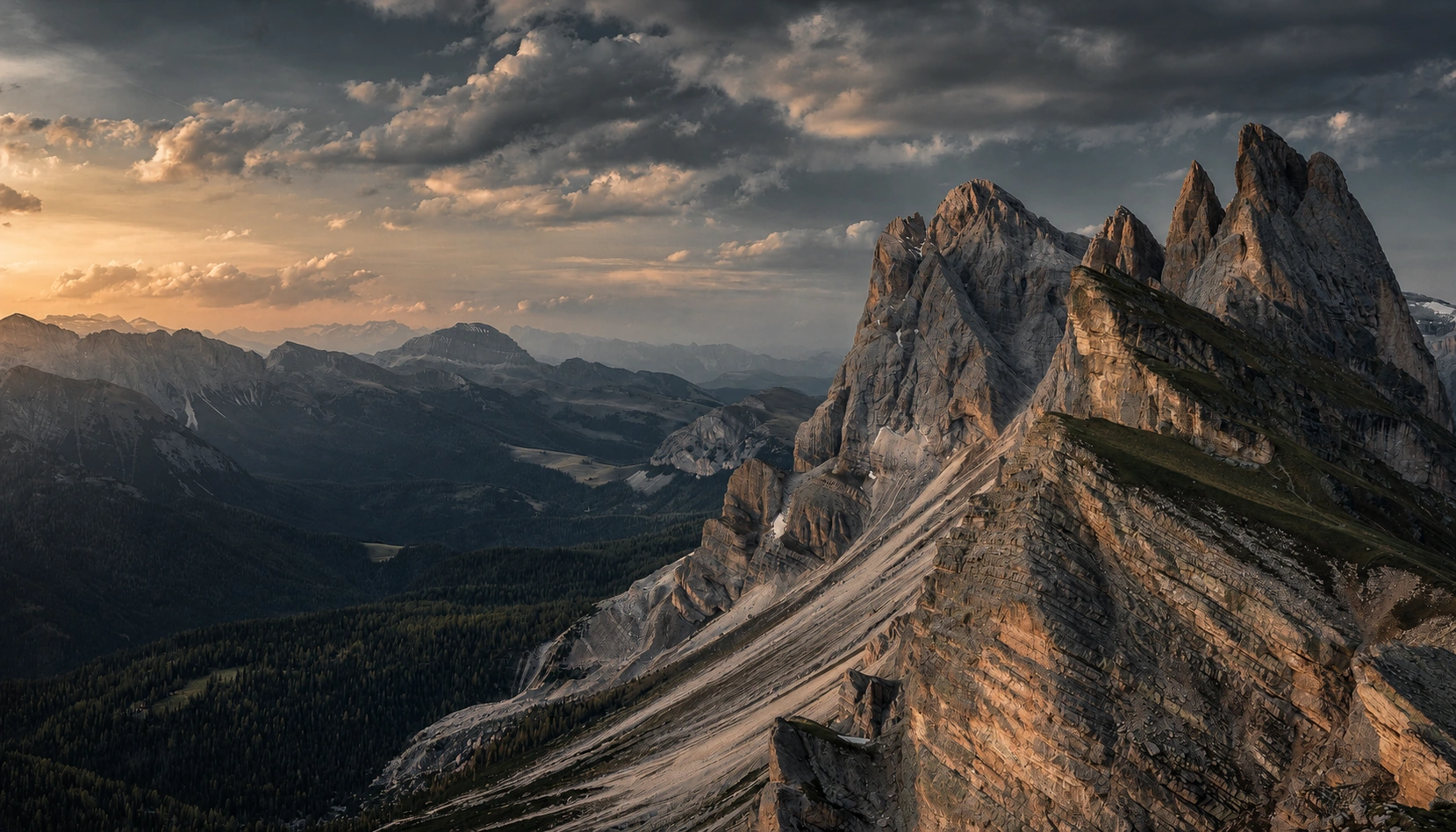 Jagged mountain peaks above a forested valley beneath layered slate clouds and warm sidelight; an AI-graded version of the user-provided landscape.